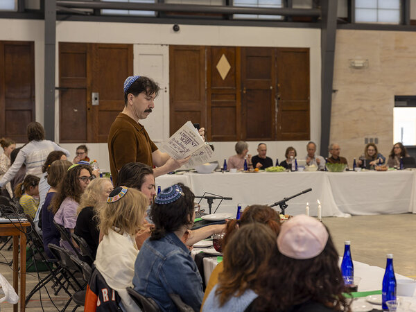Music faculty member leads Passover Seder. 