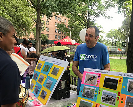 Jason Smith talking to NYC residents about climate change and wetlands