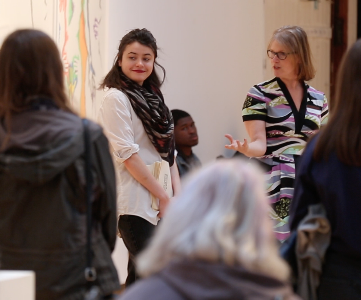 group of staff in a gallery talking
