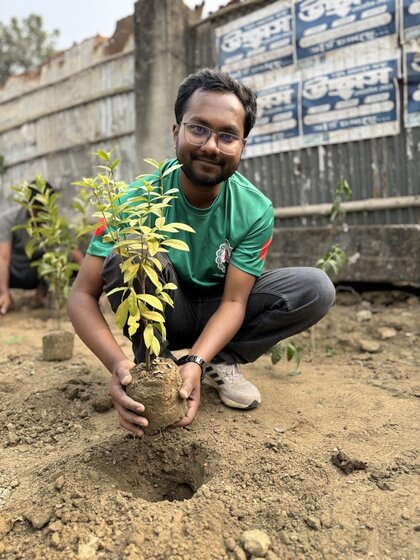Image of Mehedi Hasan Sizar ’25 planting trees 