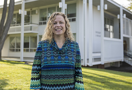 Image of woman in front of library