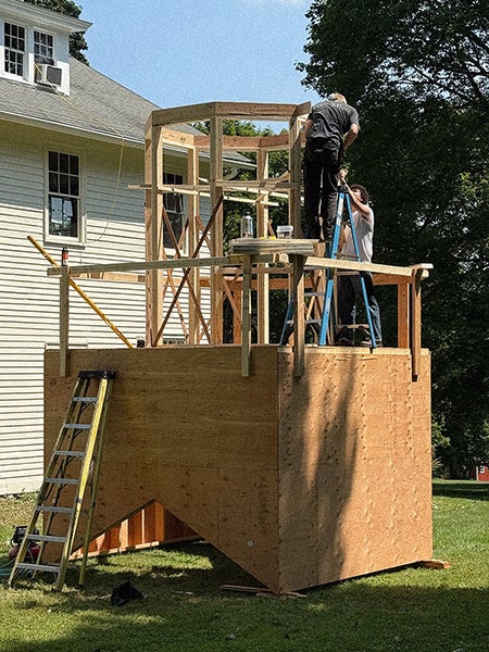 Image of students building bell tower
