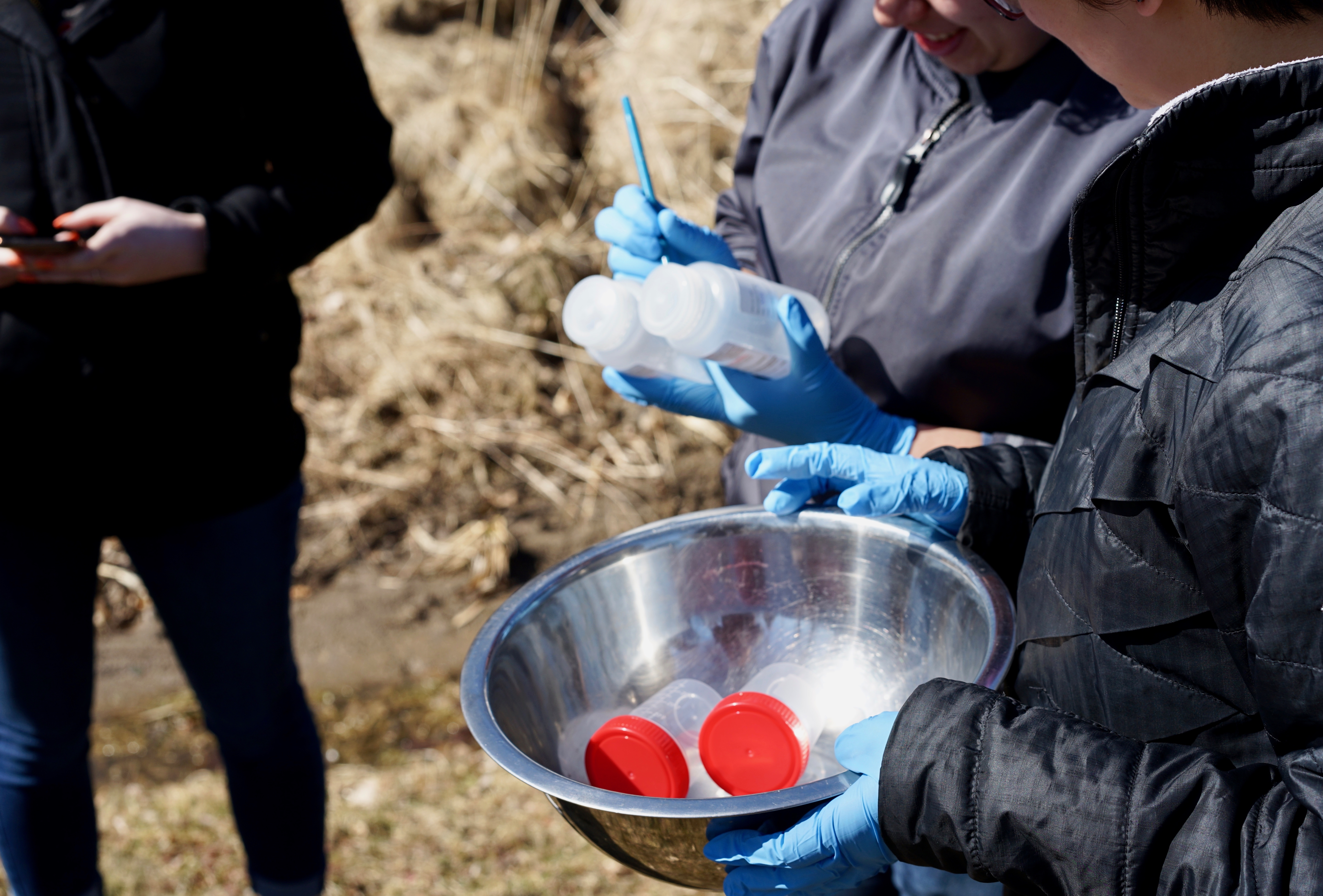 Bennington College professors and students collect soil and water samples in neighborhoods around Norlite hazardous waste incinerator (photo by David Bond)