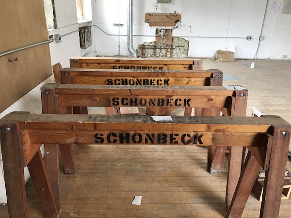 four wooden saw horses labeled Schonbeck
