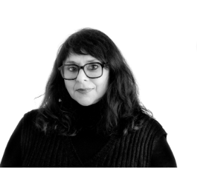 black and white photo of woman with dark hair and glasses