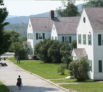 a student walks to their campus house