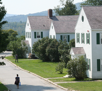 a student walks to their campus house