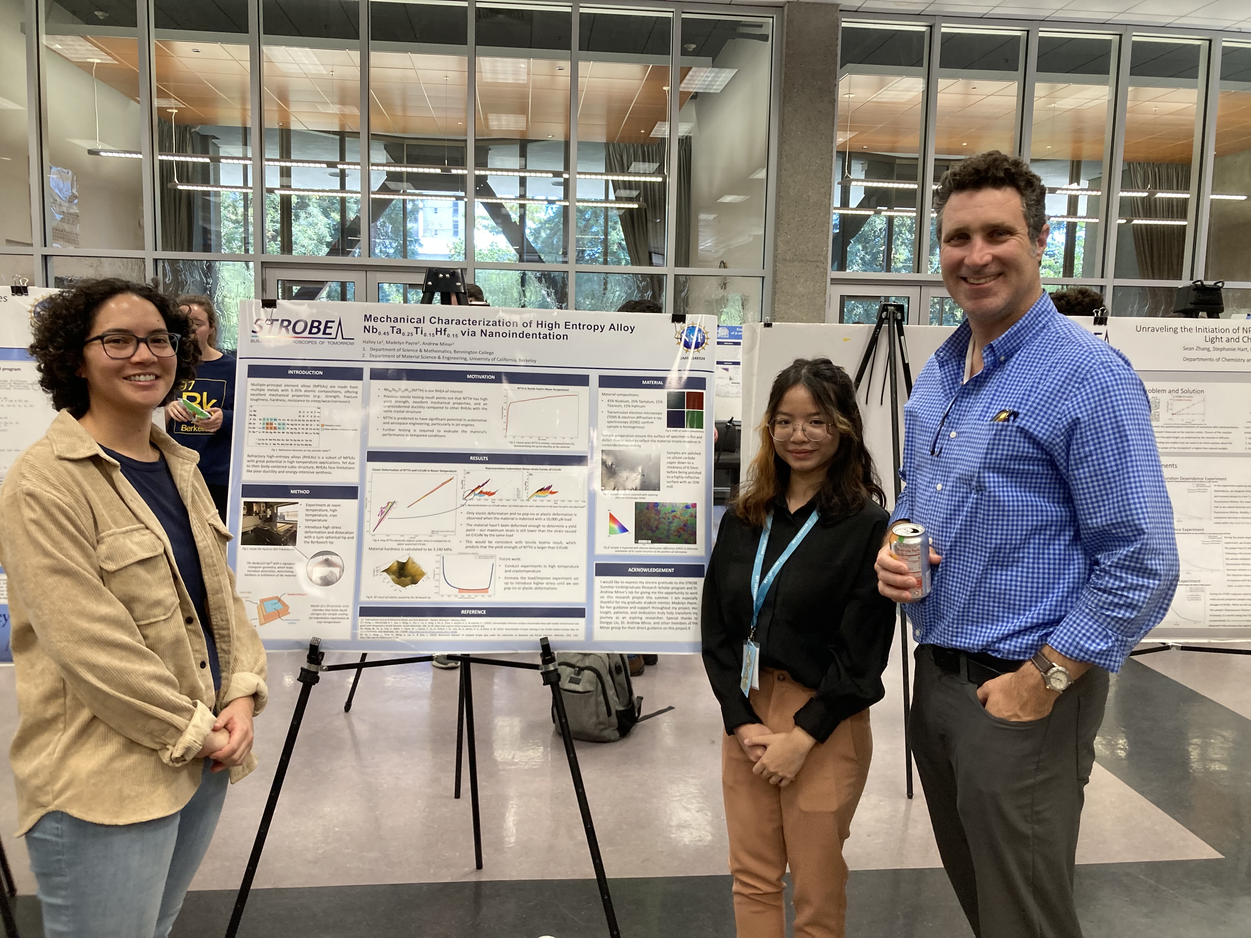 Halley Le ’25, center, at her poster presentation with graduate mentor (left) and principal investigator (right). 