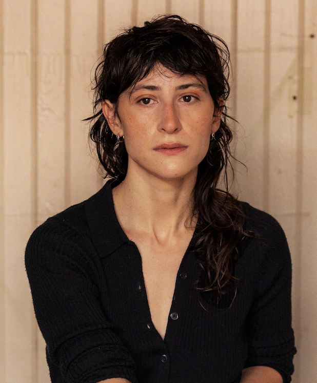 Olivia Gerber seated wearing a black shirt