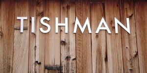 Tishman sign on wood