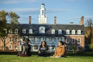 Students smiling by commons