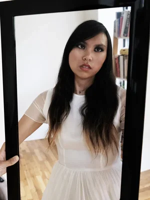 Image of Ashley Escobar in mirror