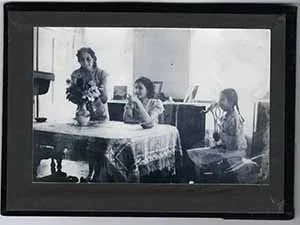 Image of three women at kitchen table