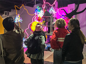 Photo of students looking at art installation