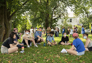 Image of students sitting in circle