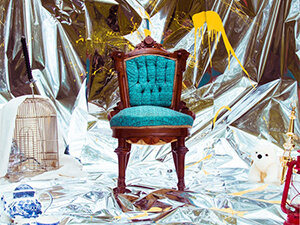 Album cover with chair on mylar backdrop