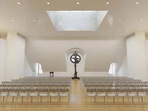 white room with rows of clear chairs