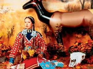 Seated woman with blow up moose in background