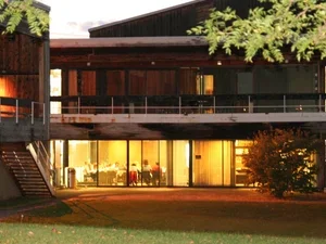 dickinson at night, wooden building with lights on