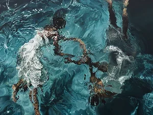 two Black women wearing white dresses underwater