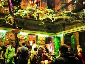 audience members in a bar looking up at the set