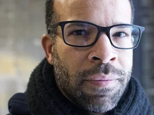 man wearing glasses and a high neck sweater