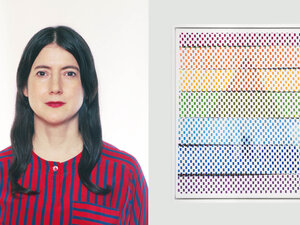 woman with red shirt and dark hair beside a piece of hanging art that looks like a chart