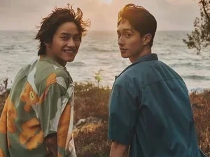 Image of two men looking at camera