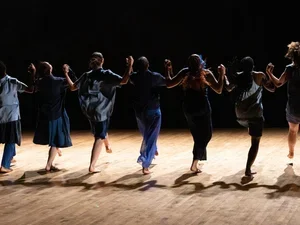 Image of dancers in a line
