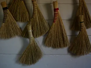 brooms hung on a wall