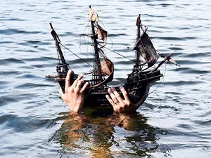 boat held up by a person under the water