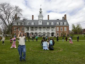Dancers on lawn in front of Commons