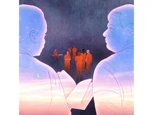 Image of teachers reading to students in jumpsuits