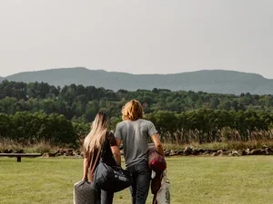 Image of two people staring at mountains