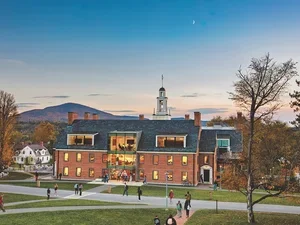 Aerial shot of students milling around Bennington College's Commons building