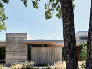 The Cuernavaca Residence- a concrete and walnut wood building with glass walls- from outside