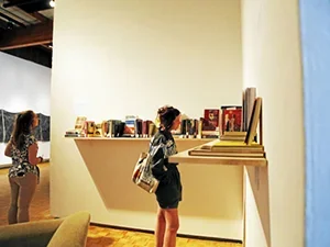 students looking at the show in usdan gallery 