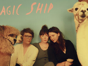 Three woman from the band Mountain Man sit with two llamas for the Magic Ship album cover