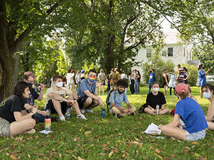 Image of students sitting in circle