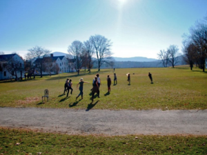 students running on commons lawn