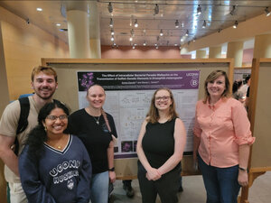 Emma Danylin ’25, center, with their research team