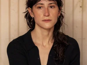 Photo of Olivia Gerber seated wearing a black shirt