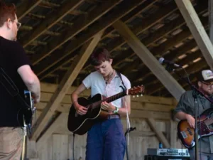 Image of Carling Berkhout playing guitar