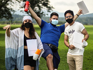 Image of three students in masks