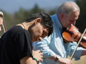 Violin players outdoors