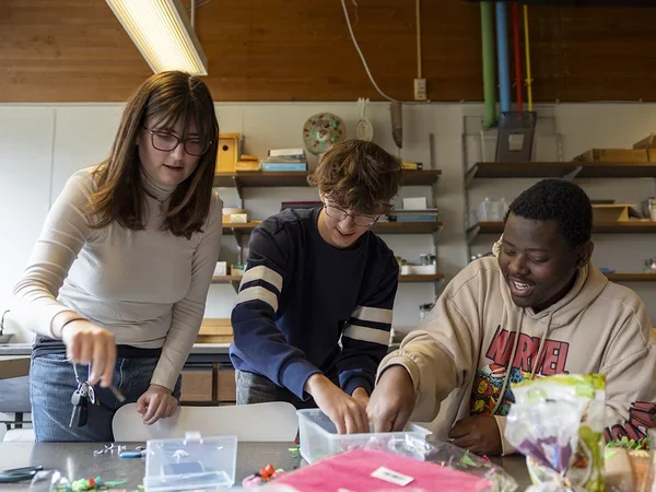 Three students working on project
