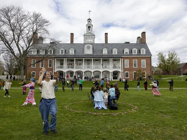 Dancers on lawn in front of Commons