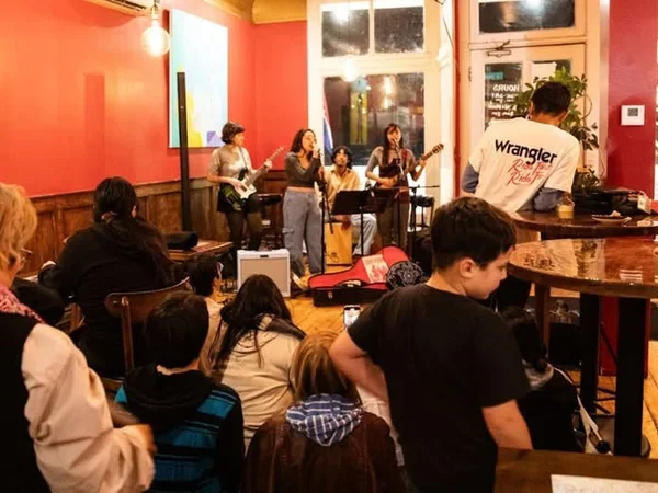 Image of band playing in cafe