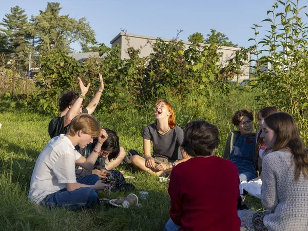 Image of students laughing outside