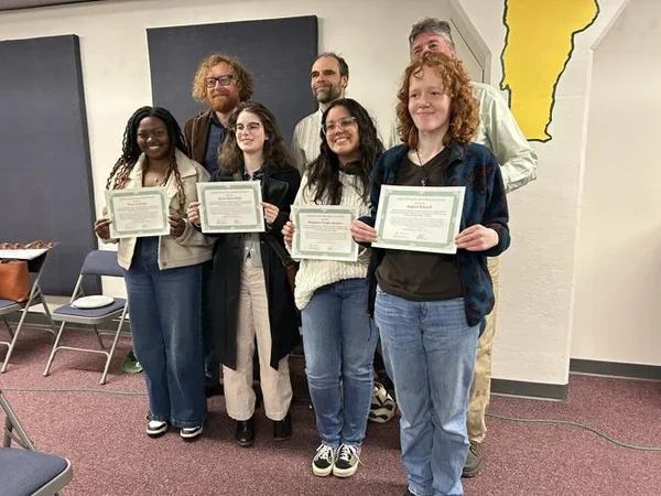 Image of students posing with certificates